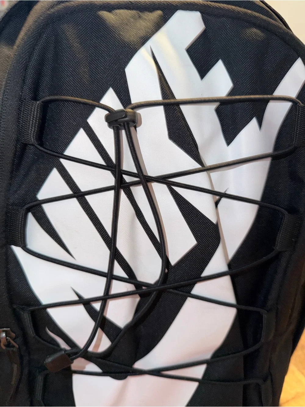 Nike Black Backpack with White Swoosh Graphic and Elastic Bungee
